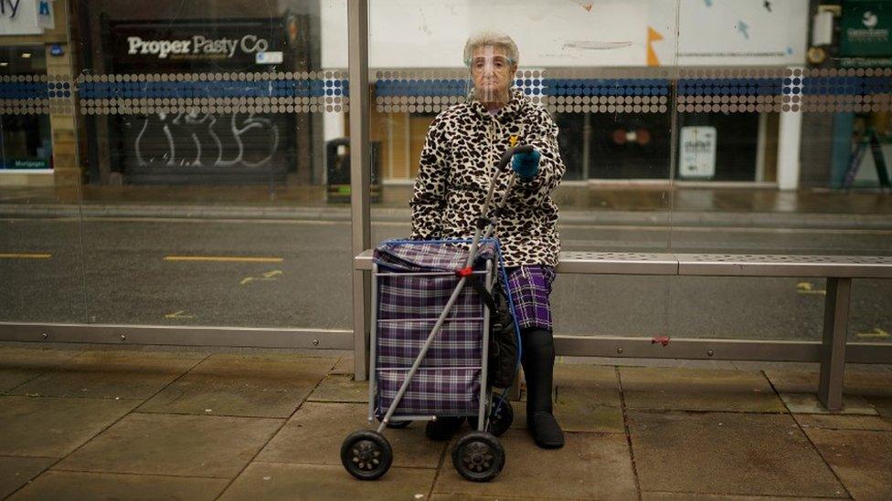 Woman wears a mask in Sheffield