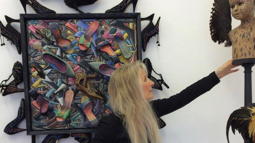 Artist P J Crook surrounded by some of her paintings and sculpture