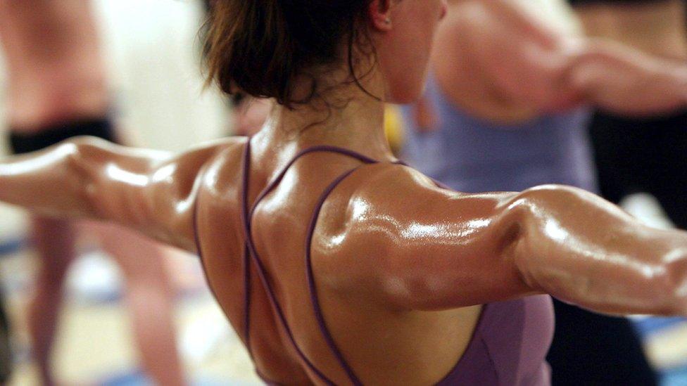 Woman doing bikram yoga