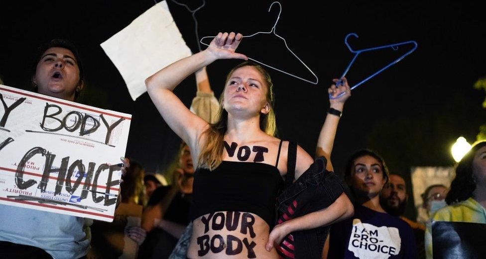 Young women protest outside