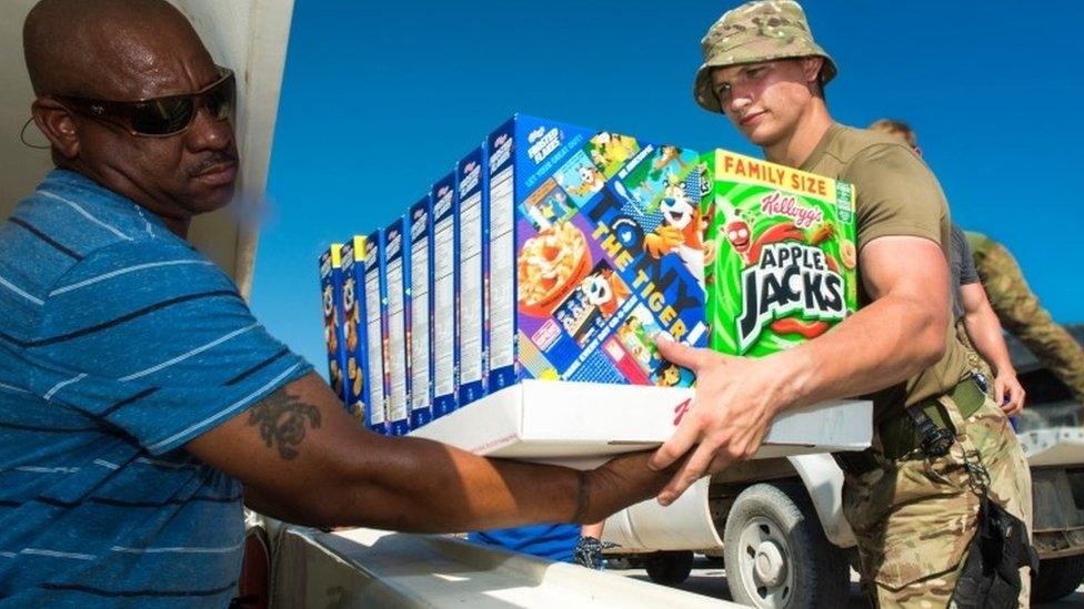 Aid being unloaded by soldiers on South Caicos ahead of the incoming storm