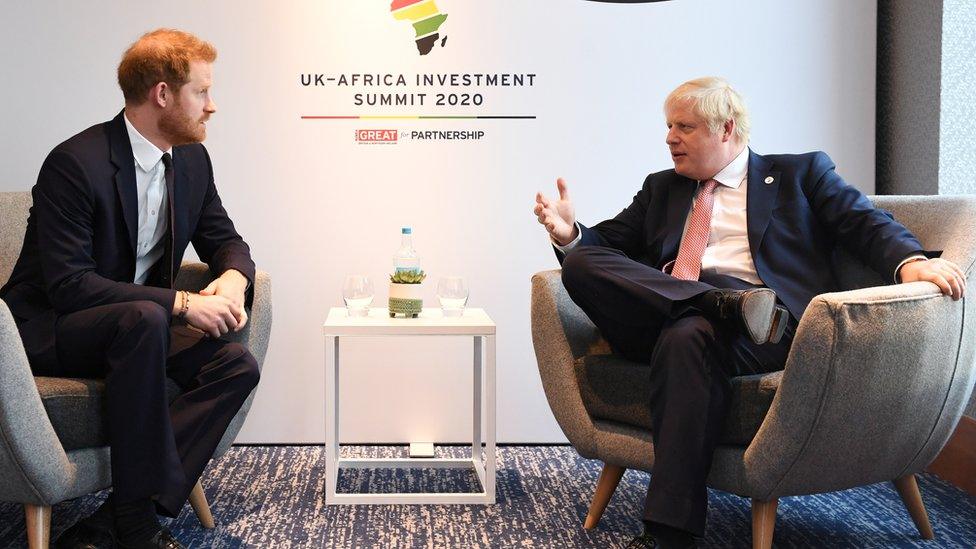 Prince Harry talks to Prime Minister Boris Johnson during the UK-Africa Investment Summit in London