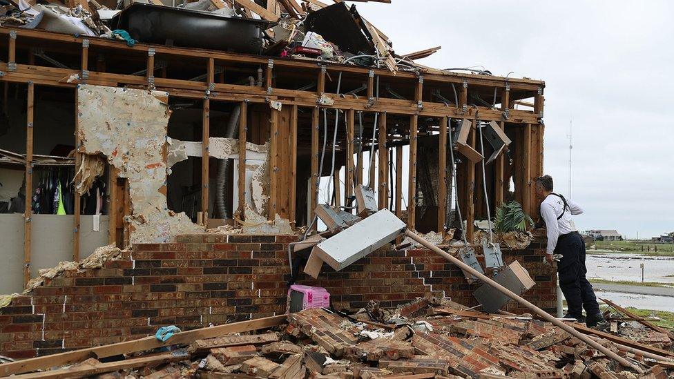 shell of a house destroyed by hurricane harvey