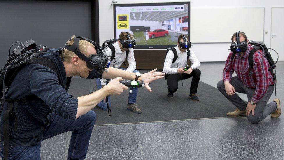 Audi workers wearing VR headsets