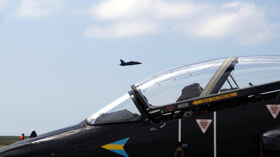 Hawk jet cockpit and jet taking off
