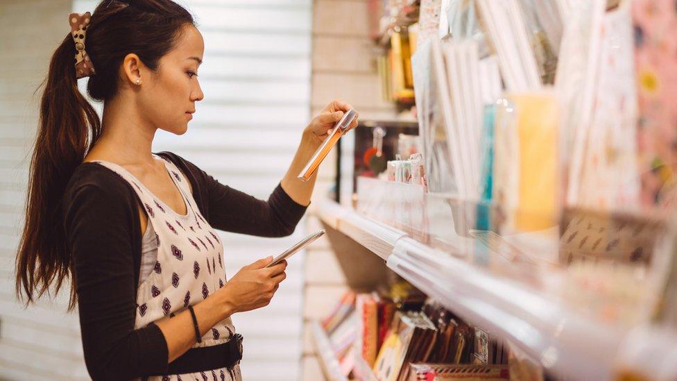 Woman buying cards