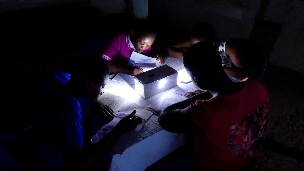 Children at home using the science kit to help them do their homework