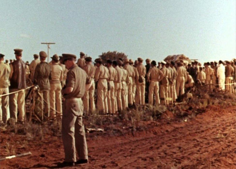 Troops turn their backs on a nuclear test at Maralinga, in South Australia