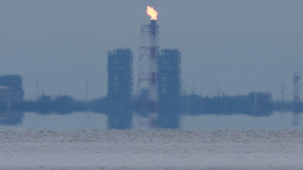 Gas flared from a smokestack at the Portovaya gas plant in Russia, August 2020