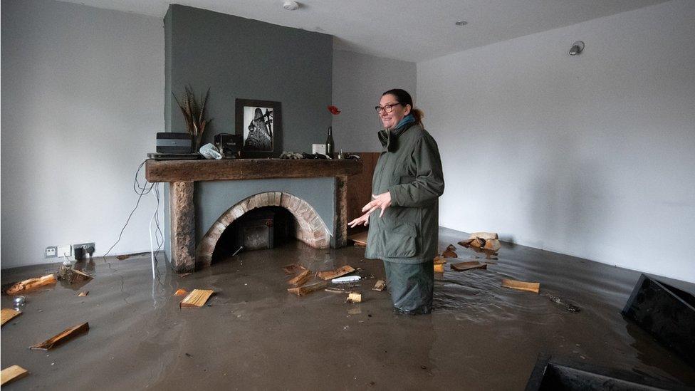 Gabrielle Burns-Smith at her flooded home in Lymm, Cheshire