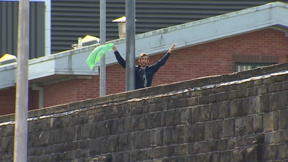 An inmate has climbed up an internal fence at Cardiff prison