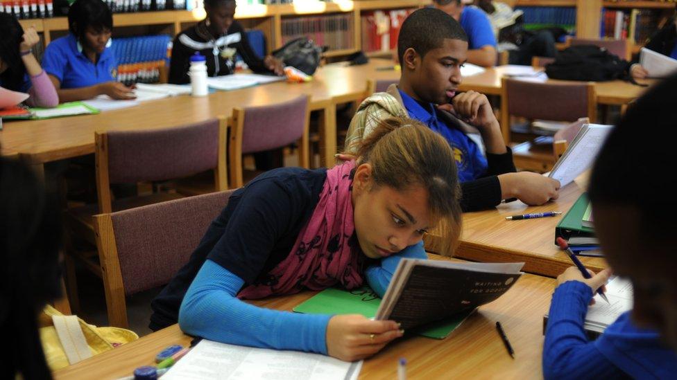 Student revising at Bronx International High School