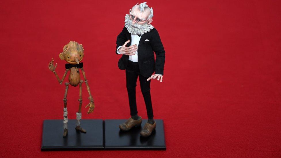 Puppets from Pinocchio by Guillermo del Toro on the red carpet for the 2023 EE BAFTA Film Awards ceremony at the Southbank Centre in London,