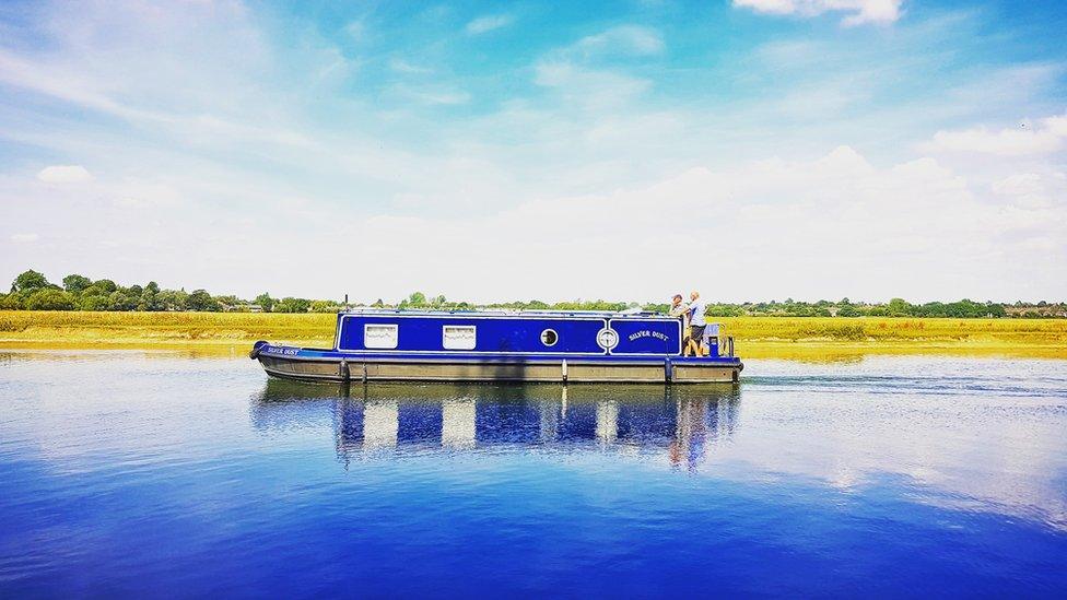 A canal boat on the Thames at Port Meadow