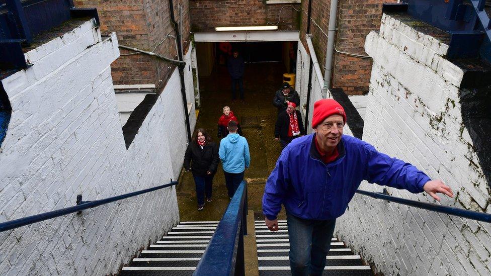 Lincoln City supporters entering the Oak Road stand