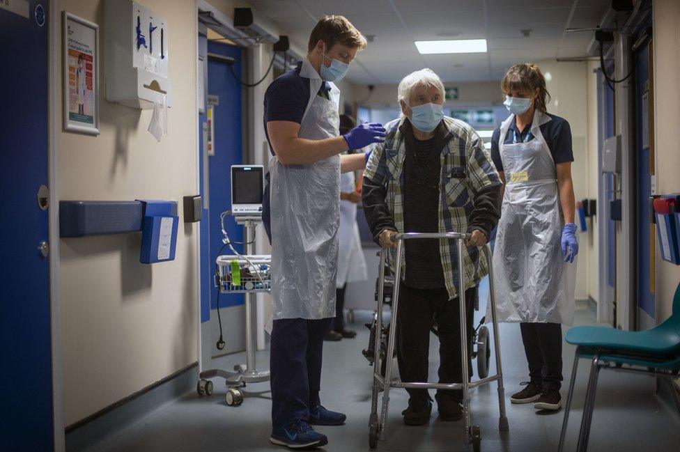 Rehab support workers with 82-year-old patient Michael Kidd