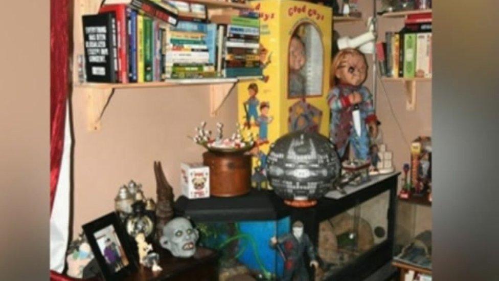 The inside of the killers' home featuring Chucky dolls