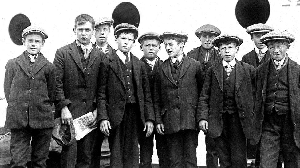 British Home Children standing in front of ship