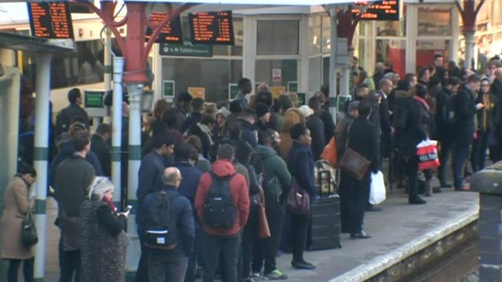 Passengers waiting on a platform