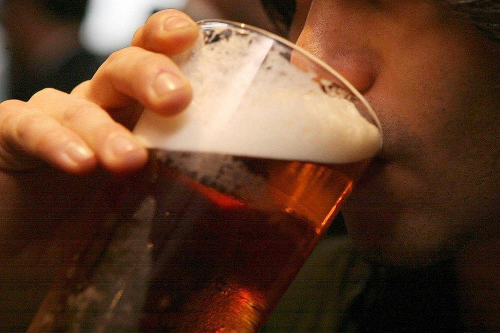 Man drinking beer from a glass