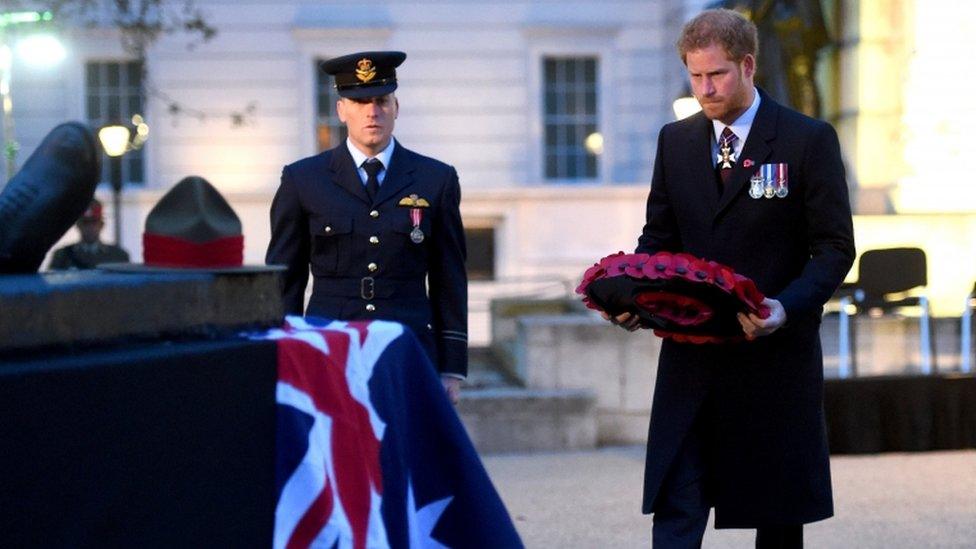 Prince Harry laying a wreath at the Anzac Day dawn service