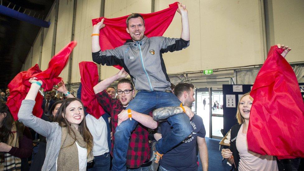 People Before Profit candidate Gerry Carroll celebrates after his election in West Belfast