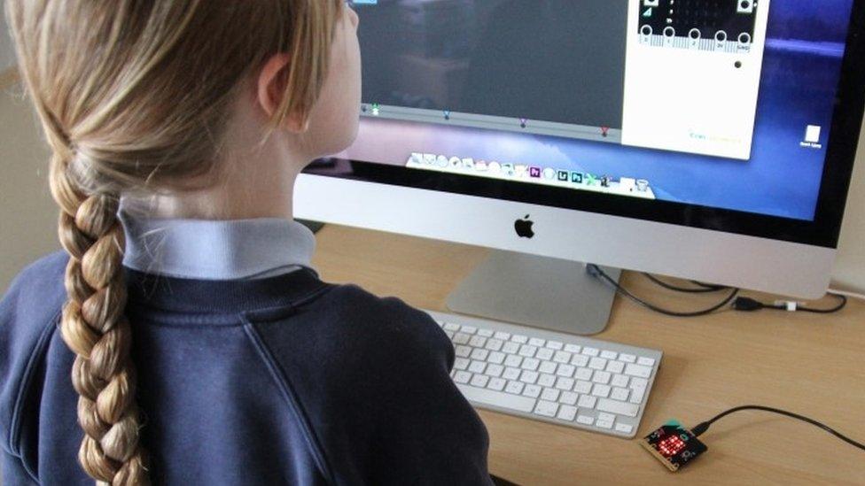 A girl using Micro Bit