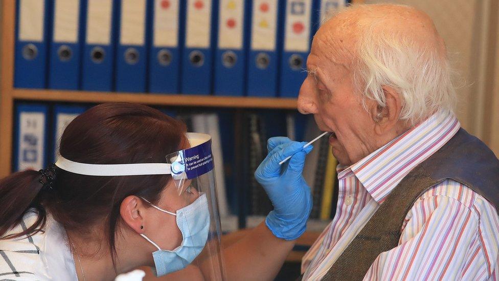 Person being tested for Covid in a care home