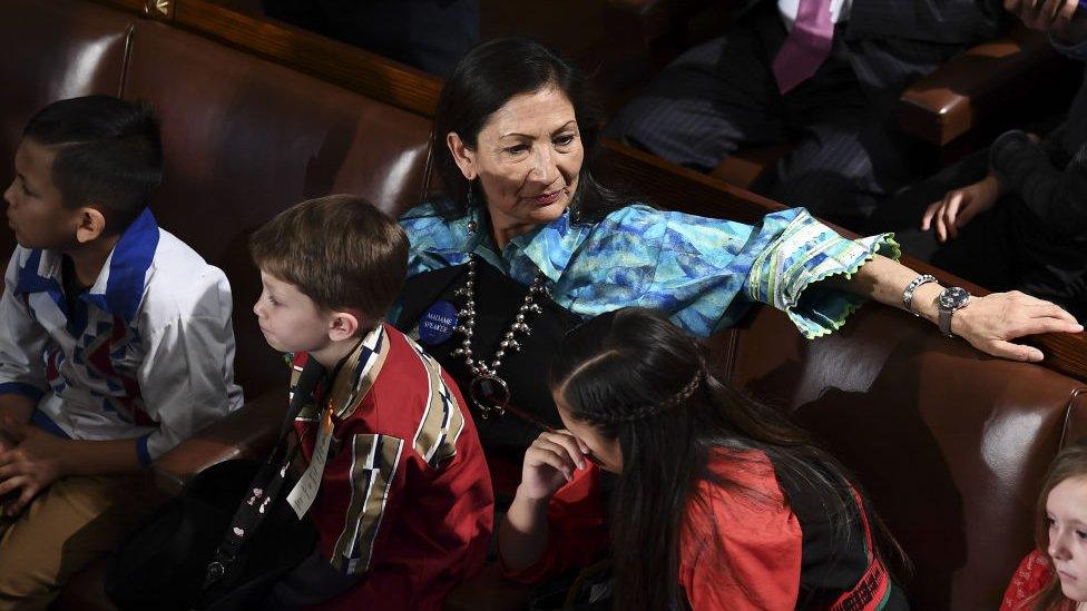 Native American Congresswoman Deb Haaland is wearing a traditional Pueblo outfit