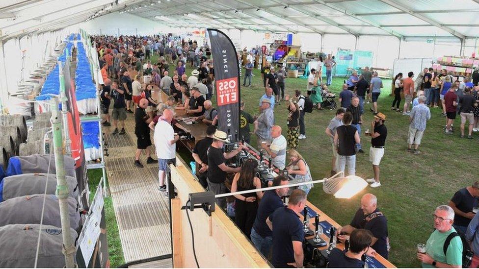 People line up for beer at the festival