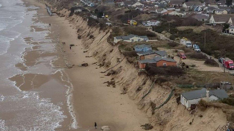 Drone shot of cliff-top chalets