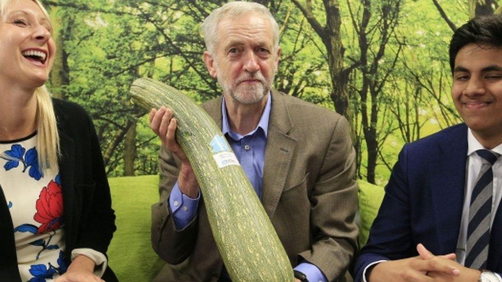 Jeremy Corbyn is presented with a marrow by local independent store during a visit to the Brighton