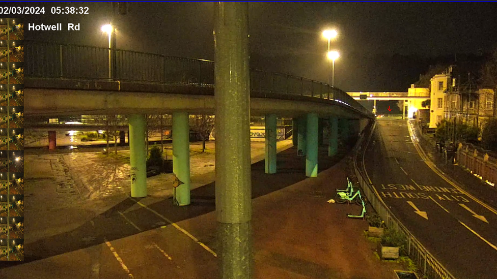 CCTV on Hotwells Road. There is a figure in the distance marked out by a red arrow