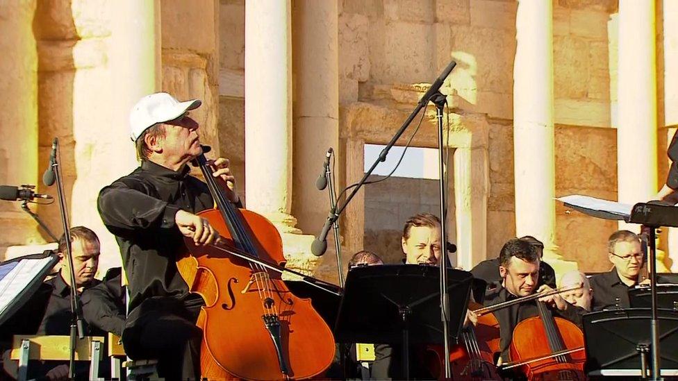 Cellist Sergei Roldugin performing at the concert in Palmyra on 5 May 2016