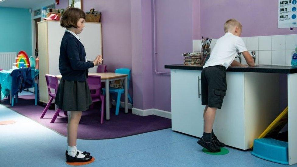 May 18, 2020 - Children abide by a traffic light system for social distancing when washing their hands at Kempsey Primary School in Worcester. Nursery and primary pupils could return to classes from June 1 following the announcement of plans for a phased reopening of schools.