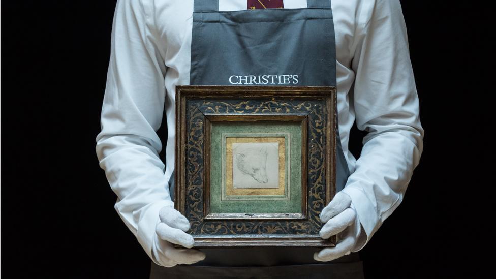 Leonardo Da Vinci's Head of a Bear held by Christie's employee