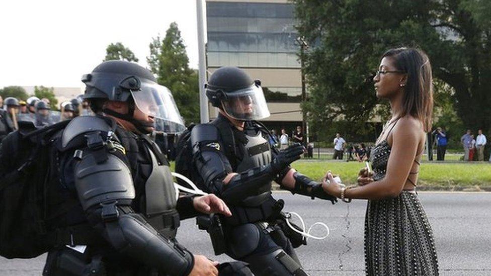 A demonstrator protesting at the shooting death of Alton Sterling is detained by law enforcement near the headquarters of the Baton Rouge Police Department in Baton Rouge, Louisiana, US July 9, 2016.