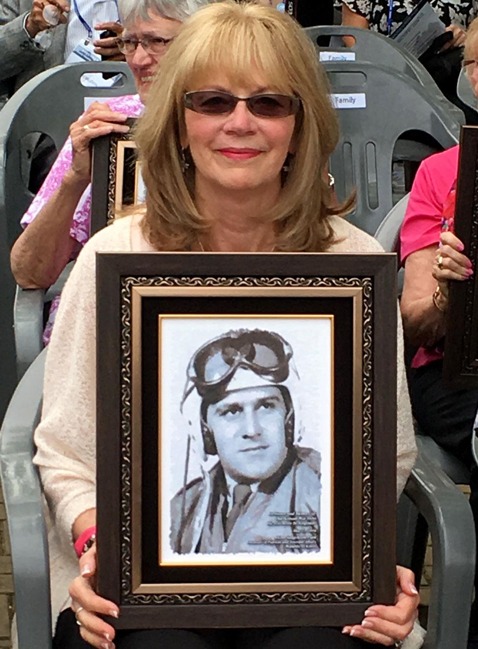 Diana Sanfilippo with a picture of her father