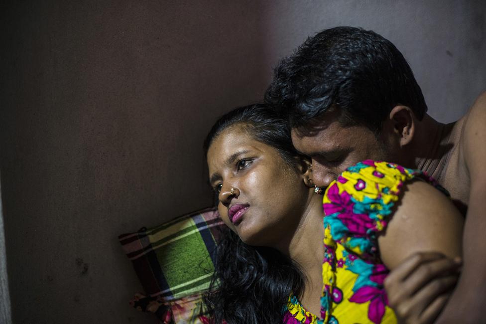 Meghla, 23, with a customer in the Kandapara brothel in Tangail. She started working for a garment factory when she was 12 years old. There she met a man who promised her a better job with more money and he sold her into a brothel.