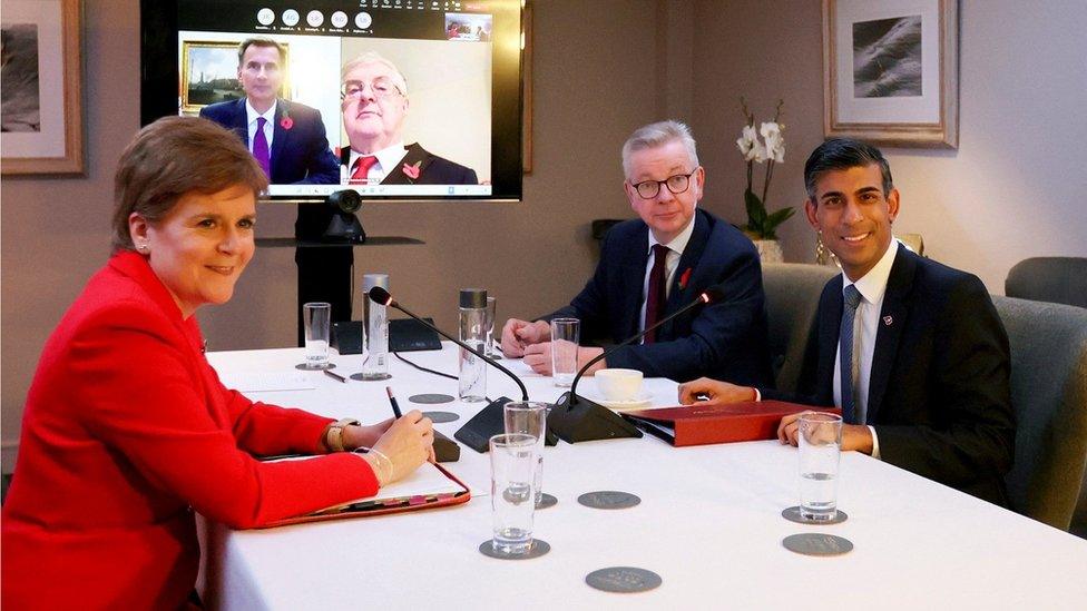 Nicola Sturgeon, Michael Gove and Rishi Sunak meet at a table, with Jeremy Hunt and Mark Drakeford on screen