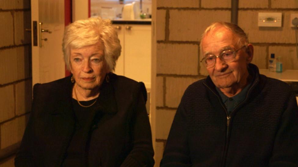 Rosemary and Donald sitting in their garage talking to Panorama