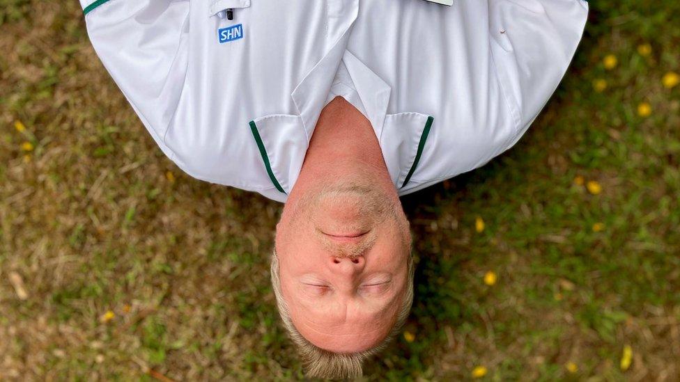 Carl Finn lying on the ground