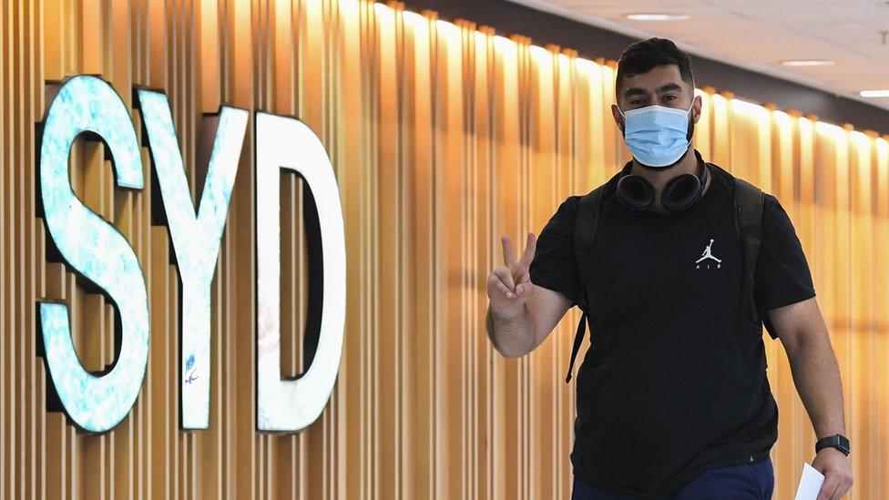 A passenger arrives at Sydney airport.