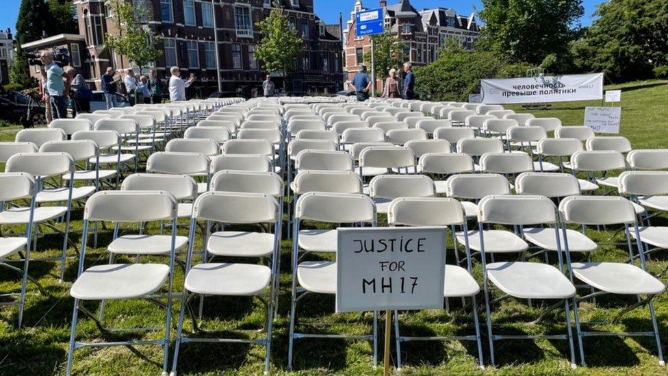 Every year the families of those who died put out 298 empty chairs in sight of the Russian embassy