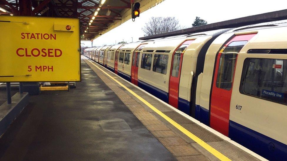 An empty Piccadilly line train stopped at Stamford Brook underground station