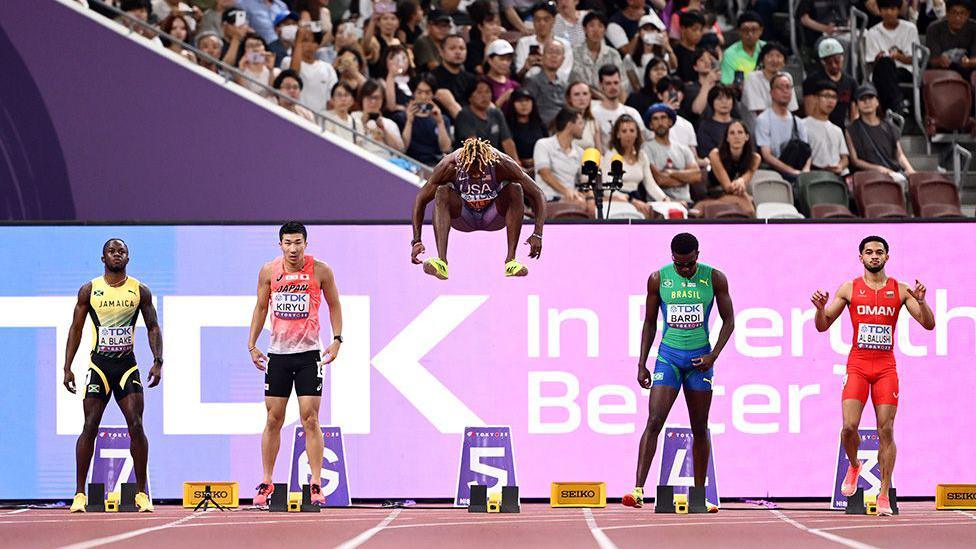 US sprint star Noah Lyles jumps in the air during his warm-up for the men's 100m heats at the World Championships in Tokyo. Photo by Hannah Peters
