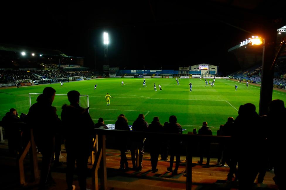 Carlisle United fans watch as their team plays Salford City