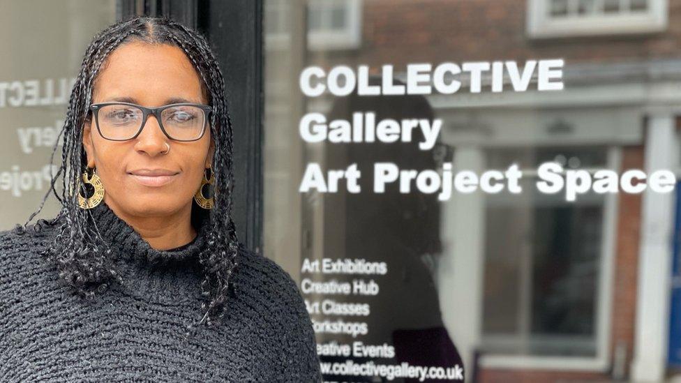 Aisha Adi, an artist from St Albans, Hertfordshire standing by the Collective Gallery, Art Project Space