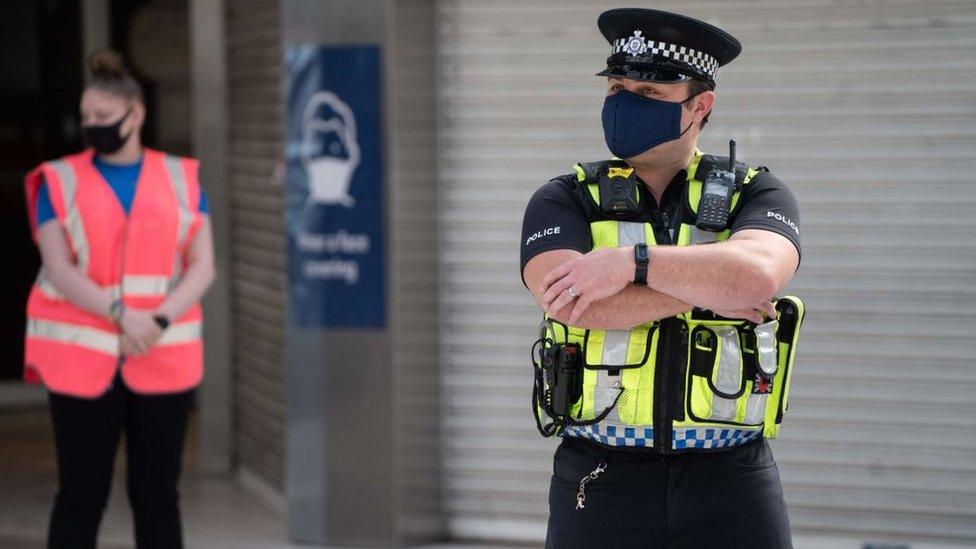 Picture of a police officer at a station