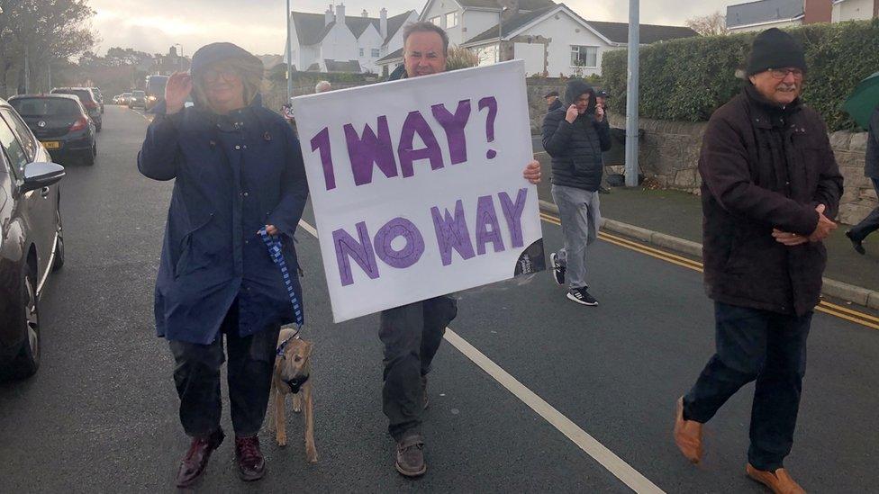 Protesters with signing saying 'One way? No way"